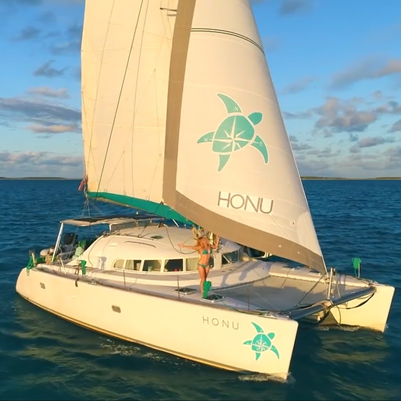 Lagoon 410 Custom Graphic Headsail with pretty lady aboard