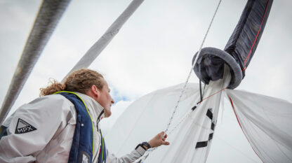 Closup of hardware on Oxley Inflatable snuffer spinnaker sock in action dousing a spinnaker.